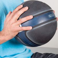 Man holding a medicine ball representing the physical therapy and pain management services at Premier Injury & Health Center in Columbus, OH